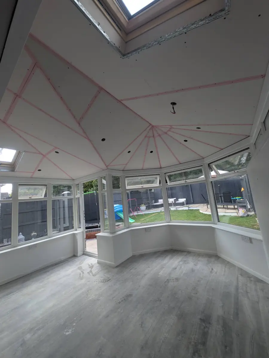 Converted conservatory boarded out with rooflights fitted