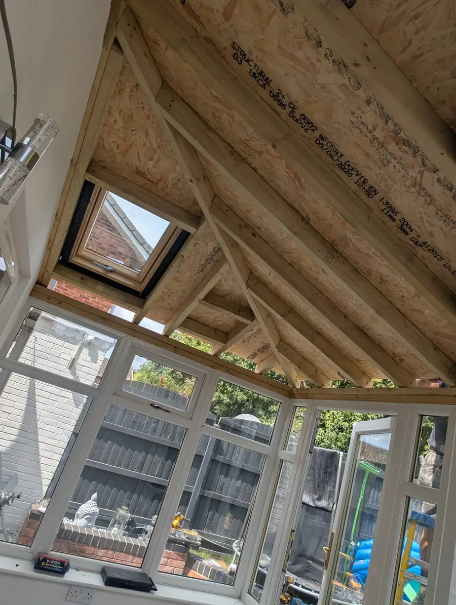Inside a conservatory showing the new timber roof structure